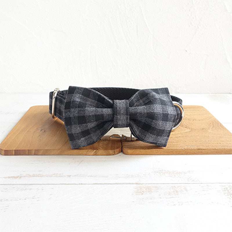 Adjustable pet leash training collar with black and gray checkered bow tie made of polyester